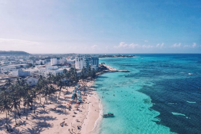 Aerial View Of Seascape Against Blue Sky During Sunny Day